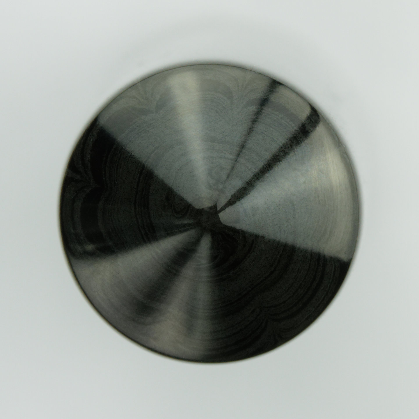 Ripples in the ebonite cap